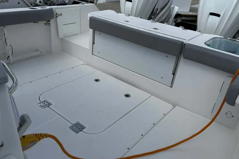 Slide: The Image of 2022 Everglades 365 Center Console boat interior with seating and storage compartments. - 29