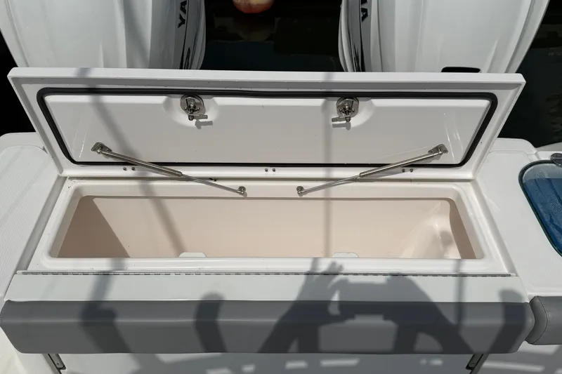 Slide: The Image of Open storage compartment on 2022 Everglades 365 Center Console boat, showcasing interior space. - 39
