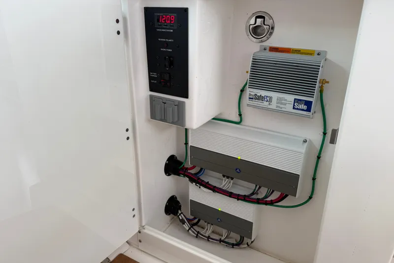 Slide: The Image of Electrical panel inside 2022 Everglades 365 Center Console boat, featuring ProSafe FS30 system. - 37