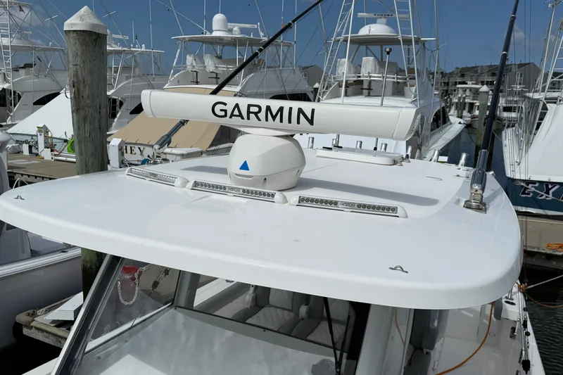 Slide: The Image of 2022 Everglades 365 Center Console boat with Garmin radar at marina. - 22