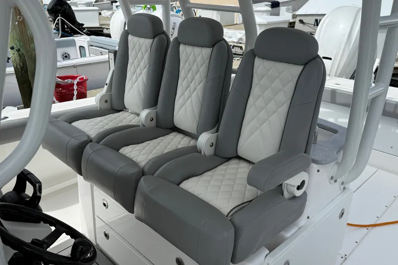 Slide: The Image of Luxury seating on 2022 Everglades 365 Center Console boat, featuring quilted upholstery. - 20