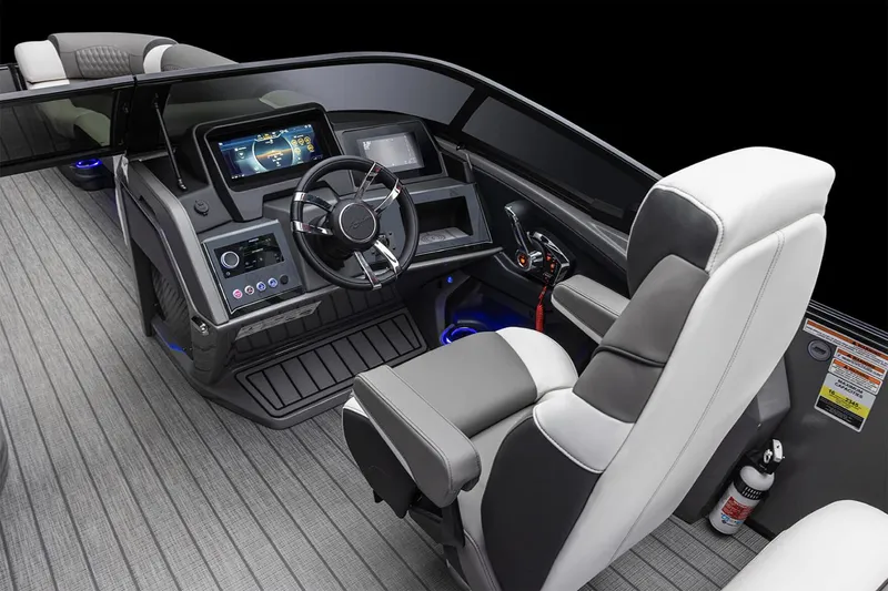 Slide: The Image of Manufacturer Provided Image: 2025 Avalon Excalibur LTD boat interior with modern dashboard and seating. - 11