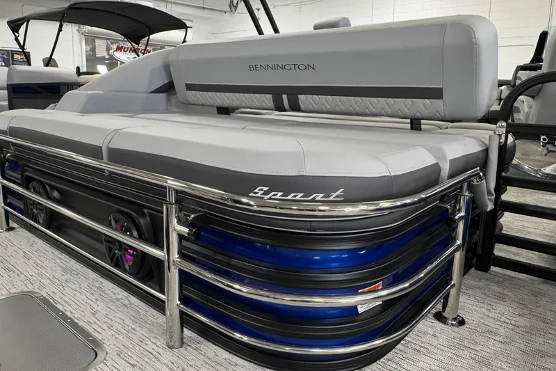 Slide: The Image of 2026 Bennington 23 M Center Swingback pontoon boat with sleek gray seating and chrome accents. - 26
