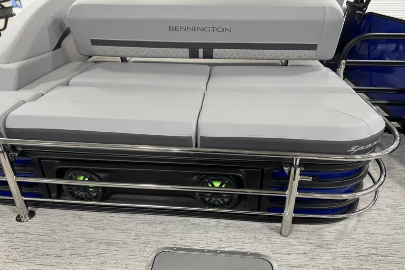 Slide: The Image of 2026 Bennington 23 M Center Swingback boat interior with cushioned seating and metal railings. - 27