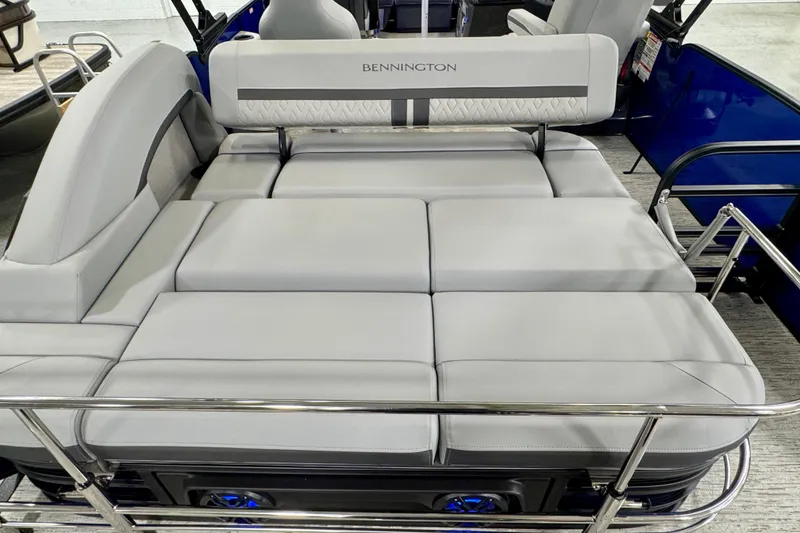 Slide: The Image of Luxurious seating on 2026 Bennington 23 M Center Swingback pontoon boat, featuring plush gray cushions. - 17
