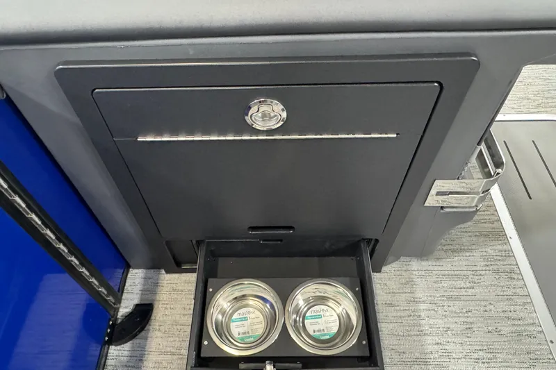 Slide: The Image of Built-in pet food drawer on 2026 Bennington 23 M Center Swingback boat. - 15