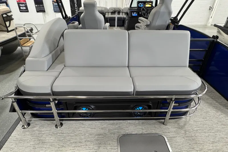 Slide: The Image of 2026 Bennington 23 M Center Swingback boat interior with gray seating and modern design. - 19