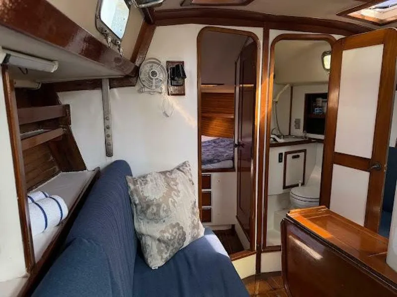 Slide: The Image of Interior of a 1989 Morgan 440 with a cozy living area and sleeping cabin. - 43