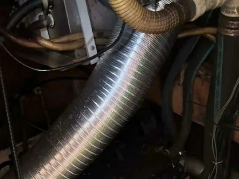 Slide: The Image of Close-up of a flexible metal hose in an engine room. - 7