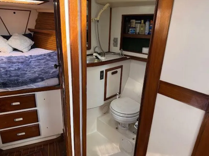 Slide: The Image of Interior of a 1989 Morgan 440 with sleeping area and bathroom. - 16