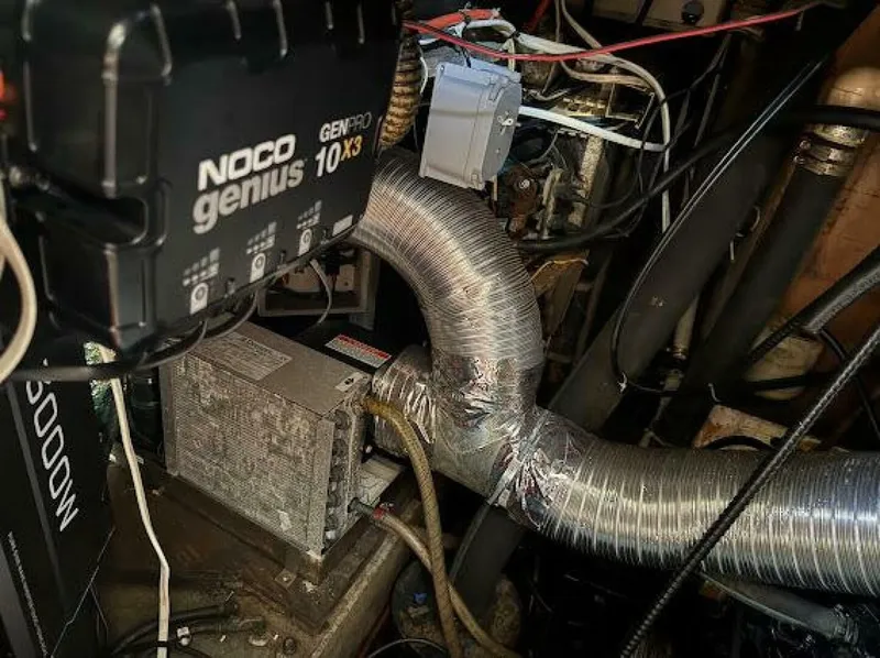 Slide: The Image of The engine room of a 1989 Morgan 440 shows electrical components and ventilation ducts. - 23