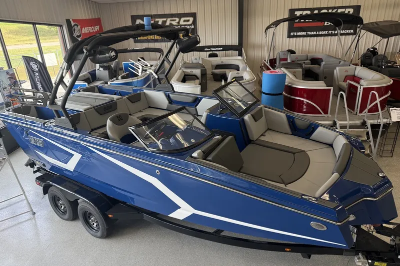 Slide: The Image of 2026 Heyday WT-2DC boat in showroom, featuring sleek blue design and modern interior. - 0