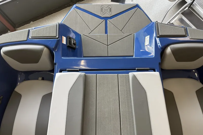 Slide: The Image of 2026 Heyday WT-2DC boat interior with gray and blue seating and modern design. - 5