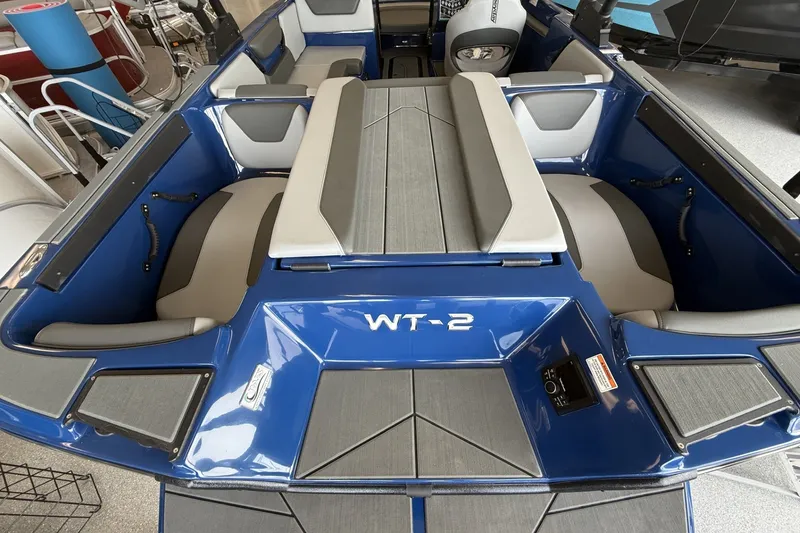 Slide: The Image of 2026 Heyday WT-2DC boat interior with blue and gray seating, showcasing modern design. - 3