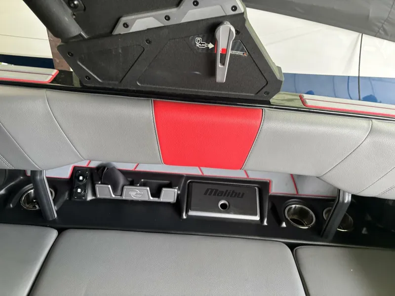 Slide: The Image of The image shows the interior of a 2022 Malibu Wakesetter 23 LSV with gray and red seating. - 17