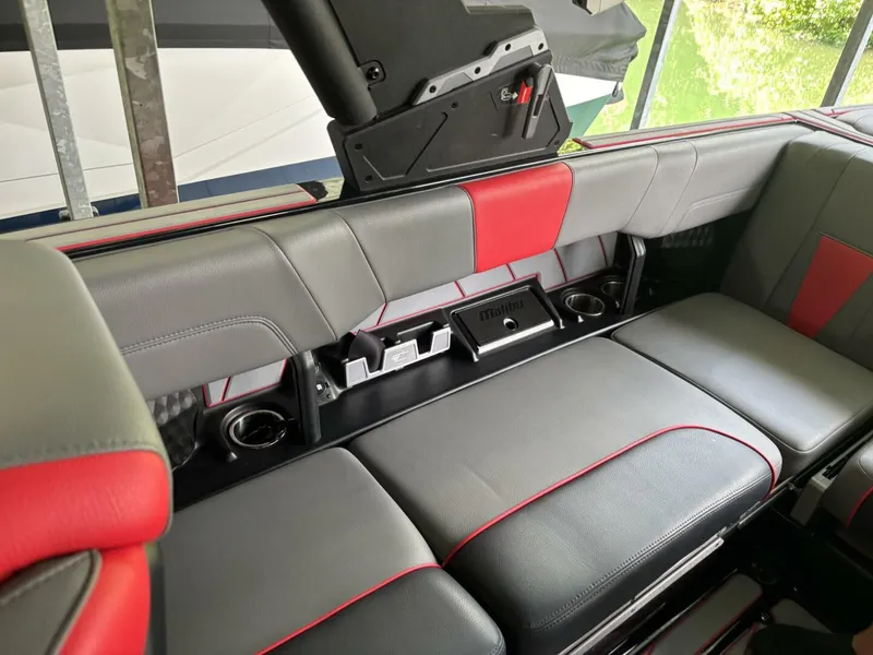 Slide: The Image of The image shows the rear seating of a 2022 Malibu Wakesetter 23 LSV with gray and red upholstery. - 48