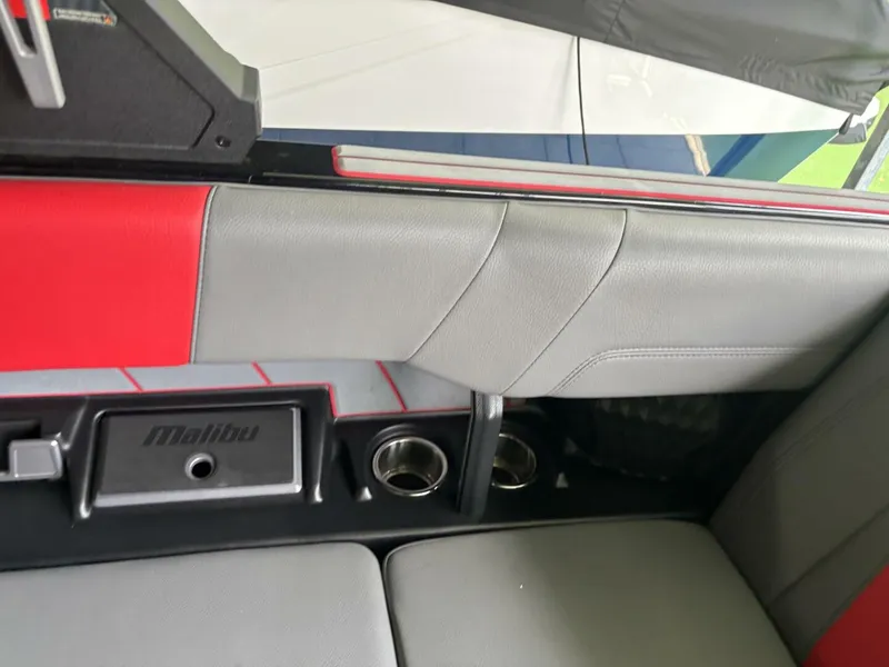 Slide: The Image of Interior view of a 2022 Malibu Wakesetter 23 LSV with gray and red seating. - 14