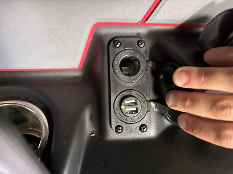 Slide: The Image of Close-up of a boat panel with USB ports and a cigarette lighter socket. - 43