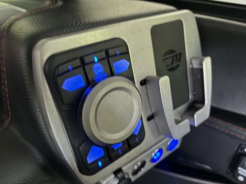 Slide: The Image of Close-up of a control panel with blue lights and a rotary knob. - 35