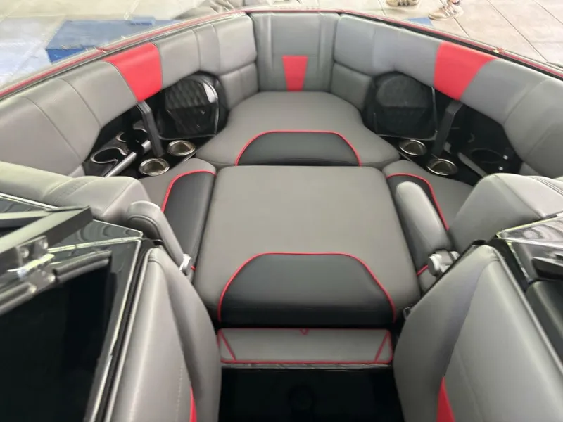 Slide: The Image of The image shows the interior of a 2022 Malibu Wakesetter 23 LSV with gray and red upholstery. - 22