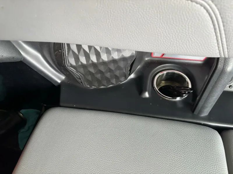 Slide: The Image of Close-up of a gray seat with a cup holder and a speaker. - 42