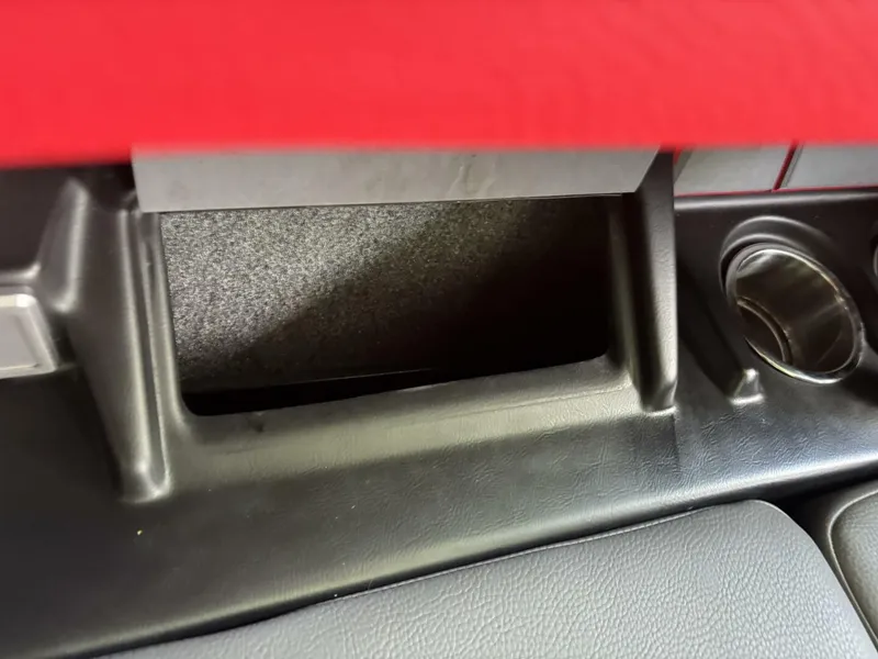 Slide: The Image of Close-up of a storage compartment and cup holder in a boat. - 45