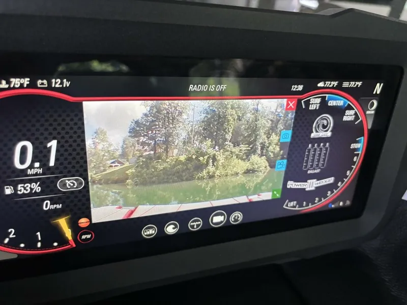 Slide: The Image of The image shows the dashboard of a Malibu Wakesetter 23 LSV with a digital display. - 29