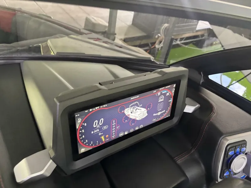 Slide: The Image of The image shows the dashboard of a Malibu Wakesetter 23 LSV with a modern touchscreen display. - 25