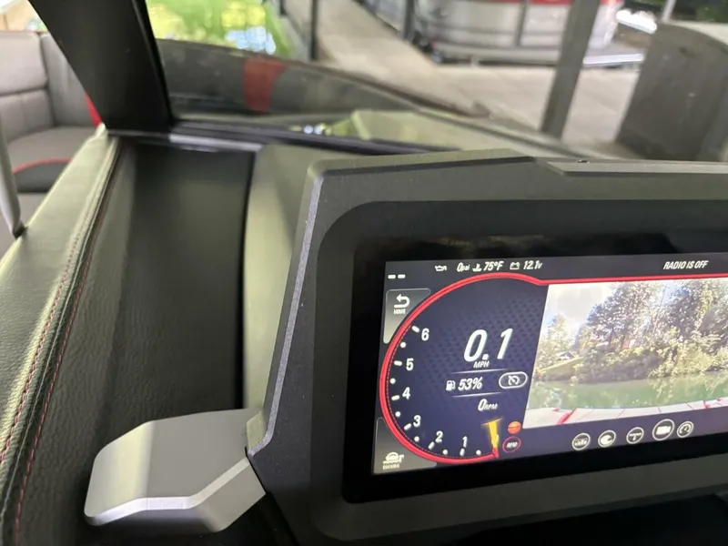 Slide: The Image of The image shows the dashboard of a Malibu Wakesetter 23 LSV with a digital display. - 16