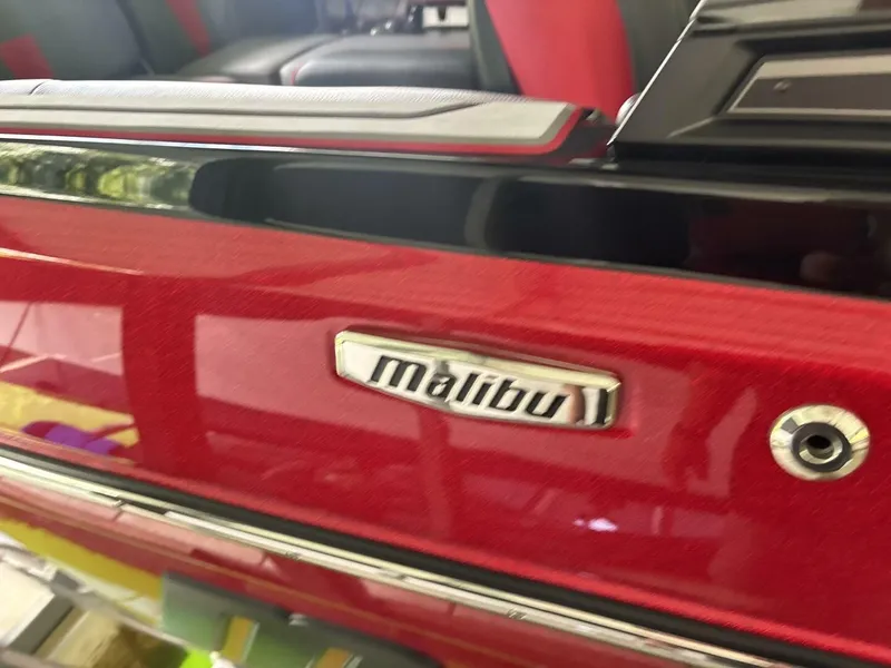 Slide: The Image of Close-up of the red Malibu Wakesetter 23 LSV with logo and glossy finish. - 13