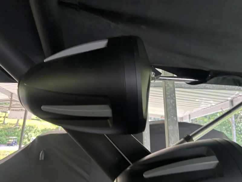 Slide: The Image of Close-up of a black speaker on a 2022 Malibu Wakesetter 23 LSV boat. - 39