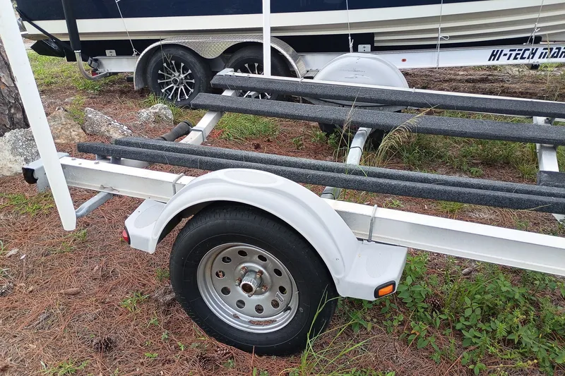 Slide: The Image of Trailer for 2010 Mako 191 Inshore boat on grassy terrain. - 13