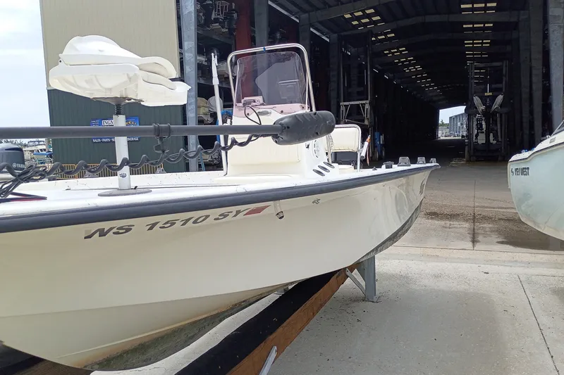 The Image of 2010 Mako 191 Inshore boat docked near a storage facility. - 0