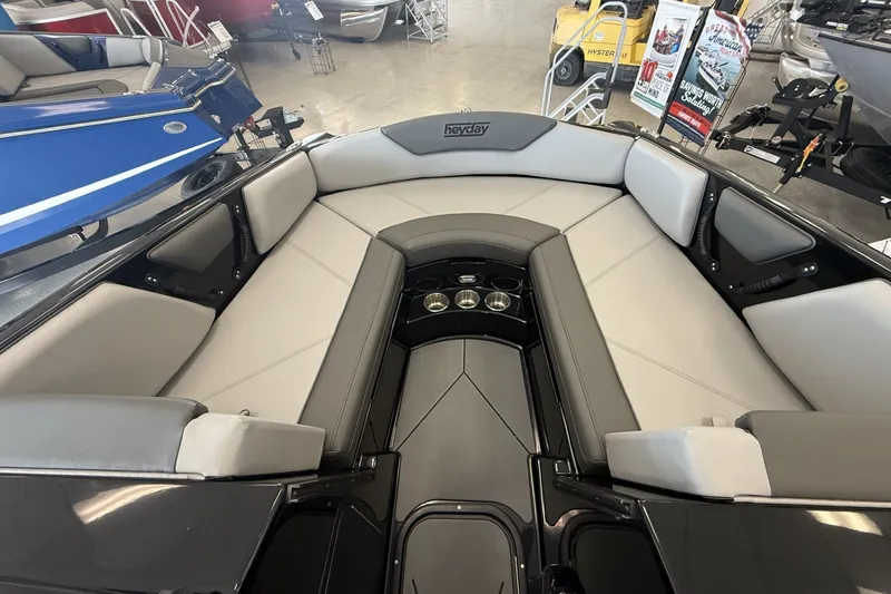 Slide: The Image of 2026 Heyday WTSurf boat interior with sleek seating and cup holders. - 11
