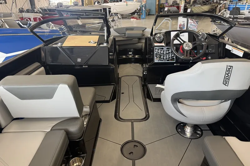 Slide: The Image of Interior of 2026 Heyday WTSurf boat with modern seating and control panel. - 10