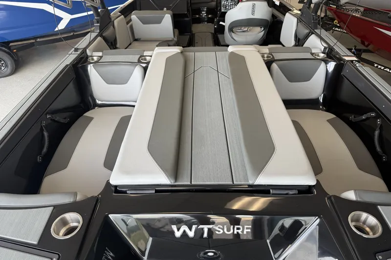 Slide: The Image of 2026 Heyday WTSurf boat interior with sleek gray seating and cup holders. - 3