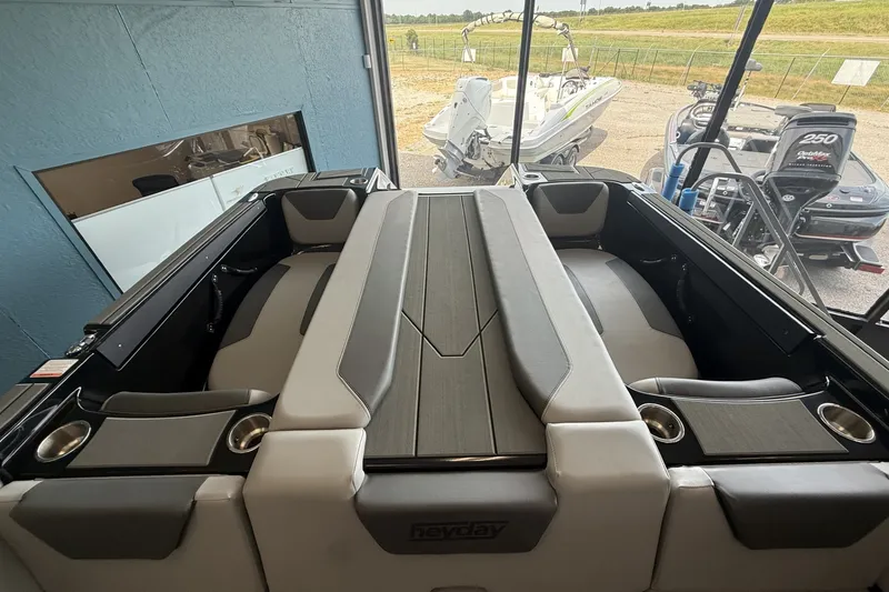 Slide: The Image of 2026 Heyday WTSurf boat interior with sleek seating and cup holders. - 6