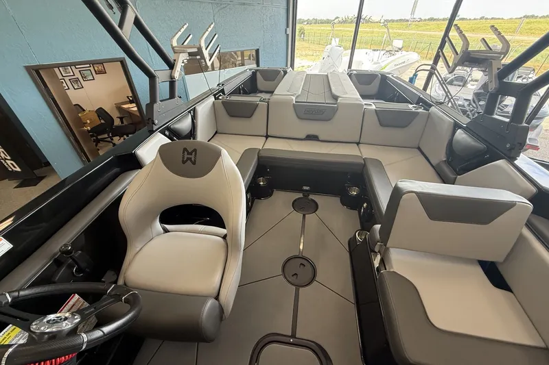 Slide: The Image of 2026 Heyday WTSurf boat interior with modern seating and steering wheel. - 9