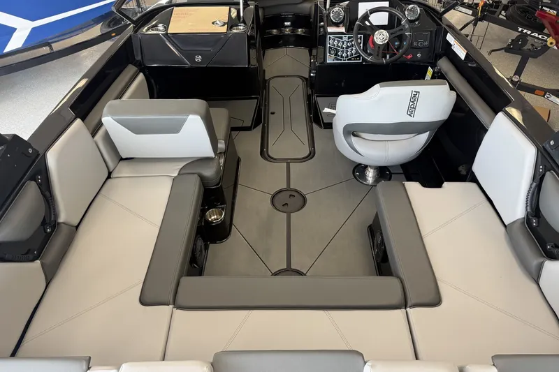 Slide: The Image of Interior of 2026 Heyday WTSurf boat with modern seating and steering console. - 8