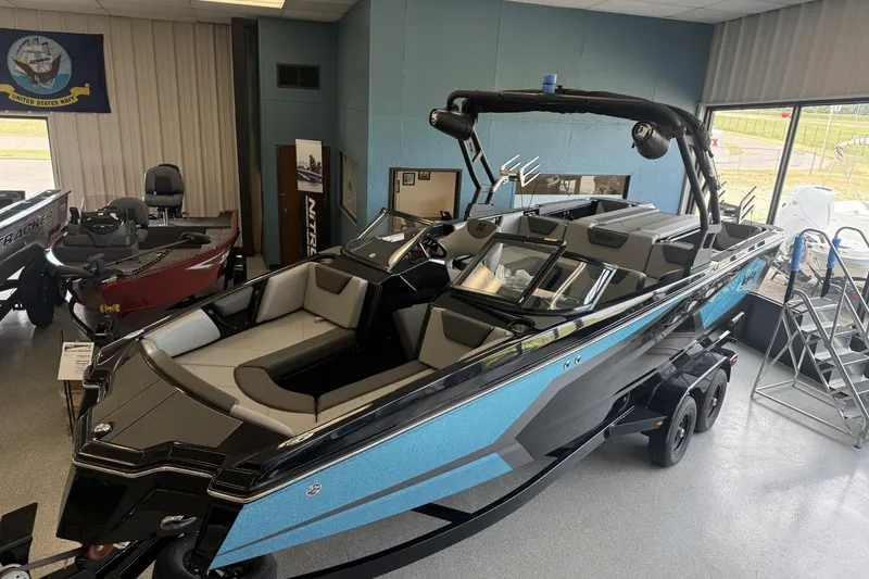 The Image of 2026 Heyday WTSurf boat displayed indoors, featuring sleek design and modern features. - 0