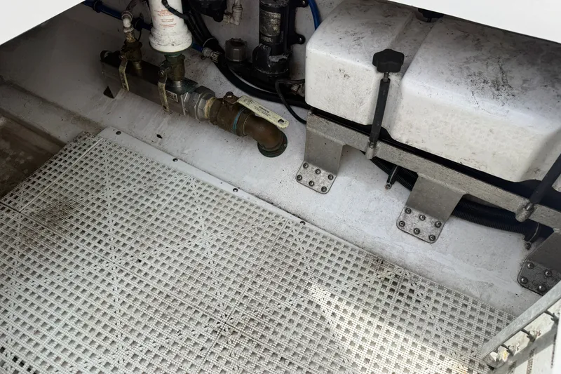 Slide: The Image of Interior view of a 2012 Everglades 325 Center Console boat's mechanical compartment. - 25