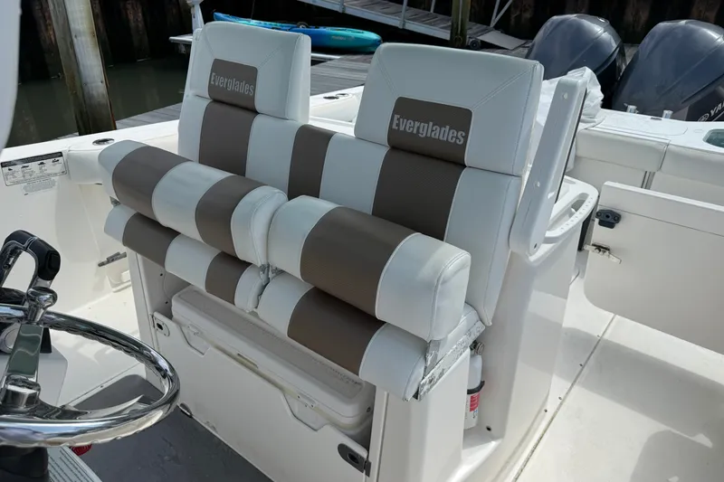 Slide: The Image of Luxury seating on a 2012 Everglades 325 Center Console boat, featuring plush cushions. - 18