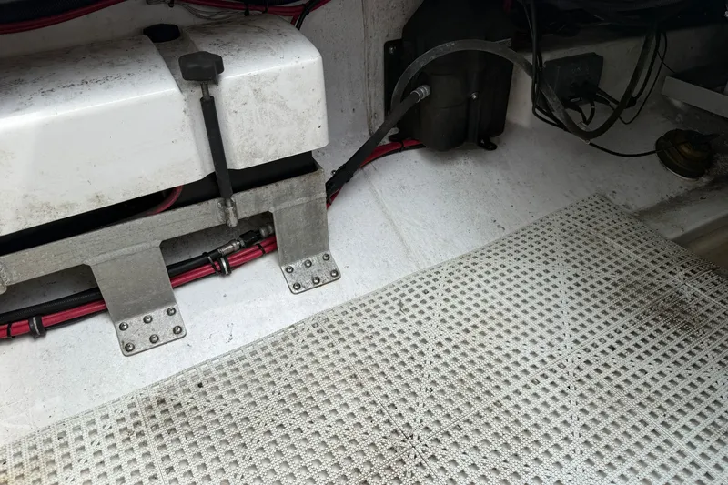 Slide: The Image of Interior view of a 2012 Everglades 325 Center Console boat, showing wiring and components. - 26