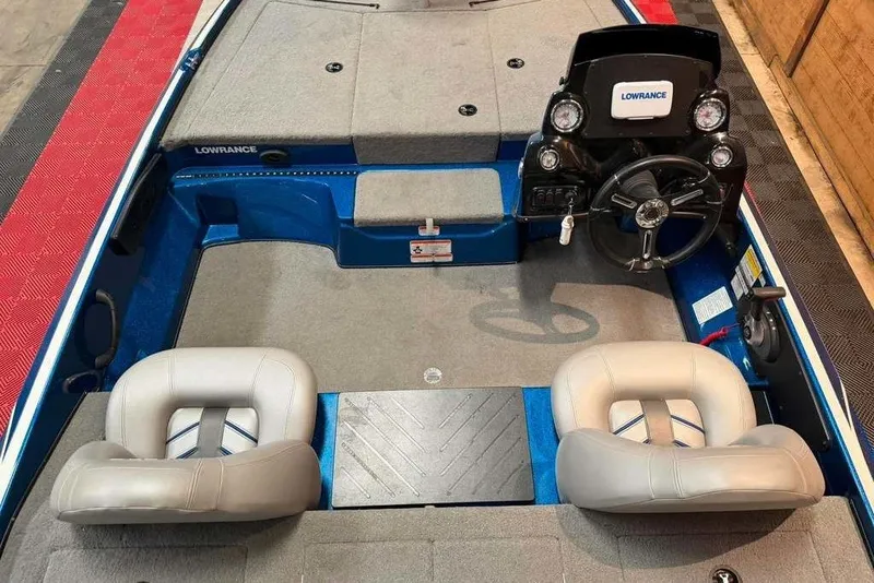 Slide: The Image of 2021 Nitro Z17 boat interior with steering console and two cushioned seats. - 6