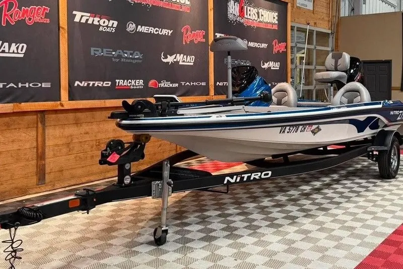 Slide: The Image of 2021 Nitro Z17 boat on display in showroom with branded backdrop. - 8