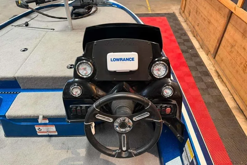 Slide: The Image of 2021 Nitro Z17 boat dashboard with Lowrance electronics and steering wheel. - 7