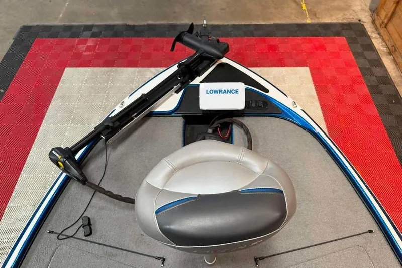 Slide: The Image of Nitro Z17 2021 boat interior with Lowrance device and trolling motor on red mat. - 3