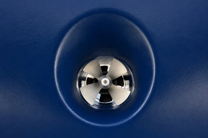Slide: The Image of Close-up of a Mason 54 boat propeller, 1989 model, against a blue background. - 8