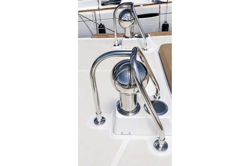 Slide: The Image of Chrome fittings on a 1989 Mason 54 yacht deck, showcasing sleek nautical design. - 15