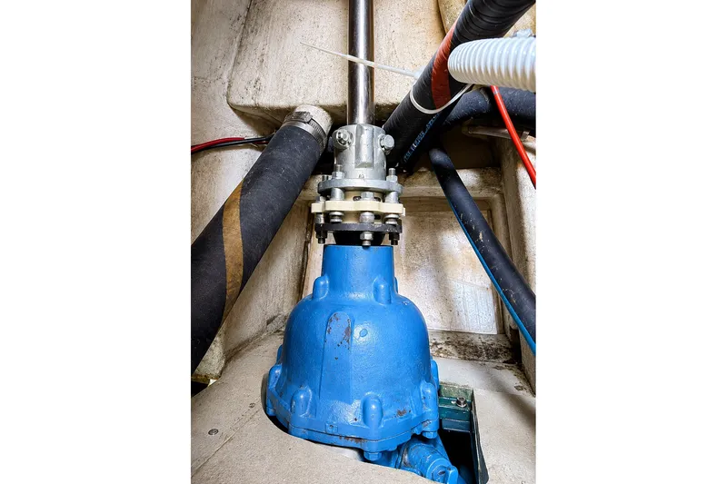 Slide: The Image of Blue mechanical component with hoses, Mason 54 model, 1989, in an industrial setting. - 47